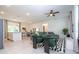 Bright, open-concept living room featuring modern decor, tiled floors, and a ceiling fan at 2024 Sw 153Rd Loop, Ocala, FL 34473