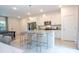 Open concept living and kitchen space with modern features, white cabinetry, and stainless steel appliances at 2024 Sw 153Rd Loop, Ocala, FL 34473