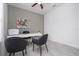 Bright office with a gray accent wall, modern desk, and ceiling fan at 2024 Sw 153Rd Loop, Ocala, FL 34473