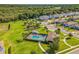 Beautiful aerial view of community featuring a pool, playground and green space, a perfect spot for recreation and relaxation at 2539 Auburn Ridge Dr, Apopka, FL 32712