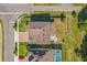 Bird's-eye view of a home with a well-maintained roof, brick driveway, landscaped backyard and neighborhood at 2539 Auburn Ridge Dr, Apopka, FL 32712