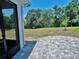 Expansive backyard with a paver patio and view of the green space, ideal for outdoor activities and relaxation at 2539 Auburn Ridge Dr, Apopka, FL 32712
