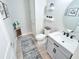 Well-lit half bathroom features a vanity, a modern faucet and neutral paint at 2539 Auburn Ridge Dr, Apopka, FL 32712