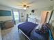 Comfortable bedroom featuring a full-size bed, dresser and mounted TV at 2539 Auburn Ridge Dr, Apopka, FL 32712