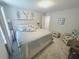 Comfortable bedroom features a neutral color scheme and a plush upholstered bed at 2539 Auburn Ridge Dr, Apopka, FL 32712