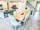 Open-concept dining room with decorative chairs and a view of the kitchen island at 2539 Auburn Ridge Dr, Apopka, FL 32712