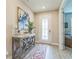 Charming entryway featuring decorative art, stylish console table, and a view of the front door that welcomes guests at 2539 Auburn Ridge Dr, Apopka, FL 32712