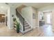 Elegant entryway showcasing an open floor plan, staircase, and stylish decor that creates a welcoming atmosphere at 2539 Auburn Ridge Dr, Apopka, FL 32712