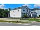 Side view of home with neutral colors, complemented by landscaped yard and partial fence at 2539 Auburn Ridge Dr, Apopka, FL 32712