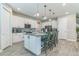 Bright kitchen with a center island, stainless steel appliances, and white cabinets at 2539 Auburn Ridge Dr, Apopka, FL 32712