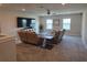 Cozy living room with plush seating, large TV, and comfortable atmosphere, perfect for relaxation and entertainment at 2539 Auburn Ridge Dr, Apopka, FL 32712
