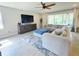 Bright living room with tile floors, neutral walls, and comfortable furnishings at 2539 Auburn Ridge Dr, Apopka, FL 32712