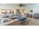 Open-concept living space featuring a sectional sofa with kitchen and staircase views at 2539 Auburn Ridge Dr, Apopka, FL 32712