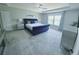Spacious main bedroom boasts plush carpet, tray ceilings and a large window for ample natural light at 2539 Auburn Ridge Dr, Apopka, FL 32712