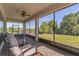 Screened-in patio boasts comfortable seating and peaceful views of the manicured backyard at 2539 Auburn Ridge Dr, Apopka, FL 32712