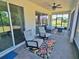 Spacious screened porch with outdoor seating and ceiling fan, overlooking a scenic backyard for relaxed enjoyment at 2539 Auburn Ridge Dr, Apopka, FL 32712