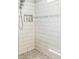 Bright shower features white subway tile, built-in niche, and a neutral accent stripe at 2539 Auburn Ridge Dr, Apopka, FL 32712