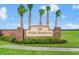 Vista Reserve community sign with lush landscaping and tall palm trees under a blue sky at 2539 Auburn Ridge Dr, Apopka, FL 32712
