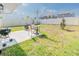 Cozy backyard patio area with outdoor seating, a grill, and a fire pit, perfect for entertaining at 26271 Feathergrass Cir, Leesburg, FL 34748
