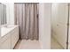Bathroom with a shower, vanity, and neutral color scheme at 26271 Feathergrass Cir, Leesburg, FL 34748