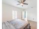Well lit bedroom offering hardwood floors, a closet, and natural light from the window at 26271 Feathergrass Cir, Leesburg, FL 34748