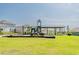 Community playground featuring swings, slides, and a picnic area for Gathering fun at 26271 Feathergrass Cir, Leesburg, FL 34748