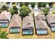 Wide aerial view showcasing homes with private pools and lush surroundings at 2648 Daulby St, Kissimmee, FL 34747