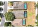 Aerial shot of homes with screened in pools, showcasing a vibrant neighborhood at 2648 Daulby St, Kissimmee, FL 34747