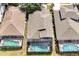 Aerial shot of homes with pools, revealing community layout and features at 2648 Daulby St, Kissimmee, FL 34747