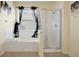 Bright bathroom featuring stand-up shower and soaking tub at 2648 Daulby St, Kissimmee, FL 34747