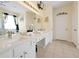 Ensuite bath with double sink vanity, soaking tub, and stand-up shower at 2648 Daulby St, Kissimmee, FL 34747