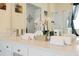 Double sink vanity with white countertops in ensuite bath at 2648 Daulby St, Kissimmee, FL 34747