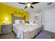 Comfortable bedroom with a ceiling fan and a decorative swan towel arrangement at 2648 Daulby St, Kissimmee, FL 34747