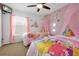Charming ' bedroom with castle and princess decor, featuring two beds with canopy at 2648 Daulby St, Kissimmee, FL 34747