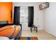 This bedroom is basketball-themed and boasts a mounted flat screen TV at 2648 Daulby St, Kissimmee, FL 34747