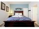 Bedroom features a wooden headboard bed with towels folded into swan shapes at 2648 Daulby St, Kissimmee, FL 34747