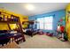 Playful bedroom with bunk beds and colorful cartoon decor at 2648 Daulby St, Kissimmee, FL 34747