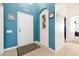 Welcoming foyer with blue walls, decorative accents, and tiled flooring for a stylish entrance at 2648 Daulby St, Kissimmee, FL 34747