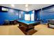 Entertainment space with a pool table, TV, 100% gamer wall art, and additional seating at 2648 Daulby St, Kissimmee, FL 34747