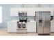 Bright kitchen featuring stainless steel appliances, quartz countertops, and ample white cabinetry at 2648 Daulby St, Kissimmee, FL 34747