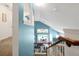 Upstairs landing area overlooking a dining area with a pool view at 2648 Daulby St, Kissimmee, FL 34747