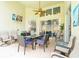 Outdoor patio with comfortable seating, a ceiling fan, and a view of the pool at 2648 Daulby St, Kissimmee, FL 34747