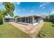 An exterior view of a large screened patio and storage at 2736 Shannon Rd, Orlando, FL 32806