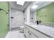 Modern bathroom featuring sleek fixtures, granite countertop, and a tiled shower with a rainfall showerhead at 2736 Shannon Rd, Orlando, FL 32806