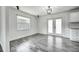 Dining area with new floors and modern lighting, ideal for Gathering meals and entertaining guests at 2736 Shannon Rd, Orlando, FL 32806