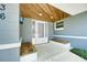 Close up view of the home entrance showcasing wooden ceiling accents and built-in benches at 2736 Shannon Rd, Orlando, FL 32806