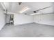 Spacious garage interior with ample storage space, laundry tub, and access door at 2736 Shannon Rd, Orlando, FL 32806