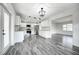 Open-concept kitchen with stainless steel appliances, sleek countertops, and new cabinets at 2736 Shannon Rd, Orlando, FL 32806