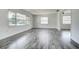 Bright living room with modern floors and large windows, perfect for comfortable living and natural light at 2736 Shannon Rd, Orlando, FL 32806