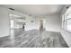 Spacious living area featuring stylish floors, open layout, and seamless flow to the kitchen at 2736 Shannon Rd, Orlando, FL 32806